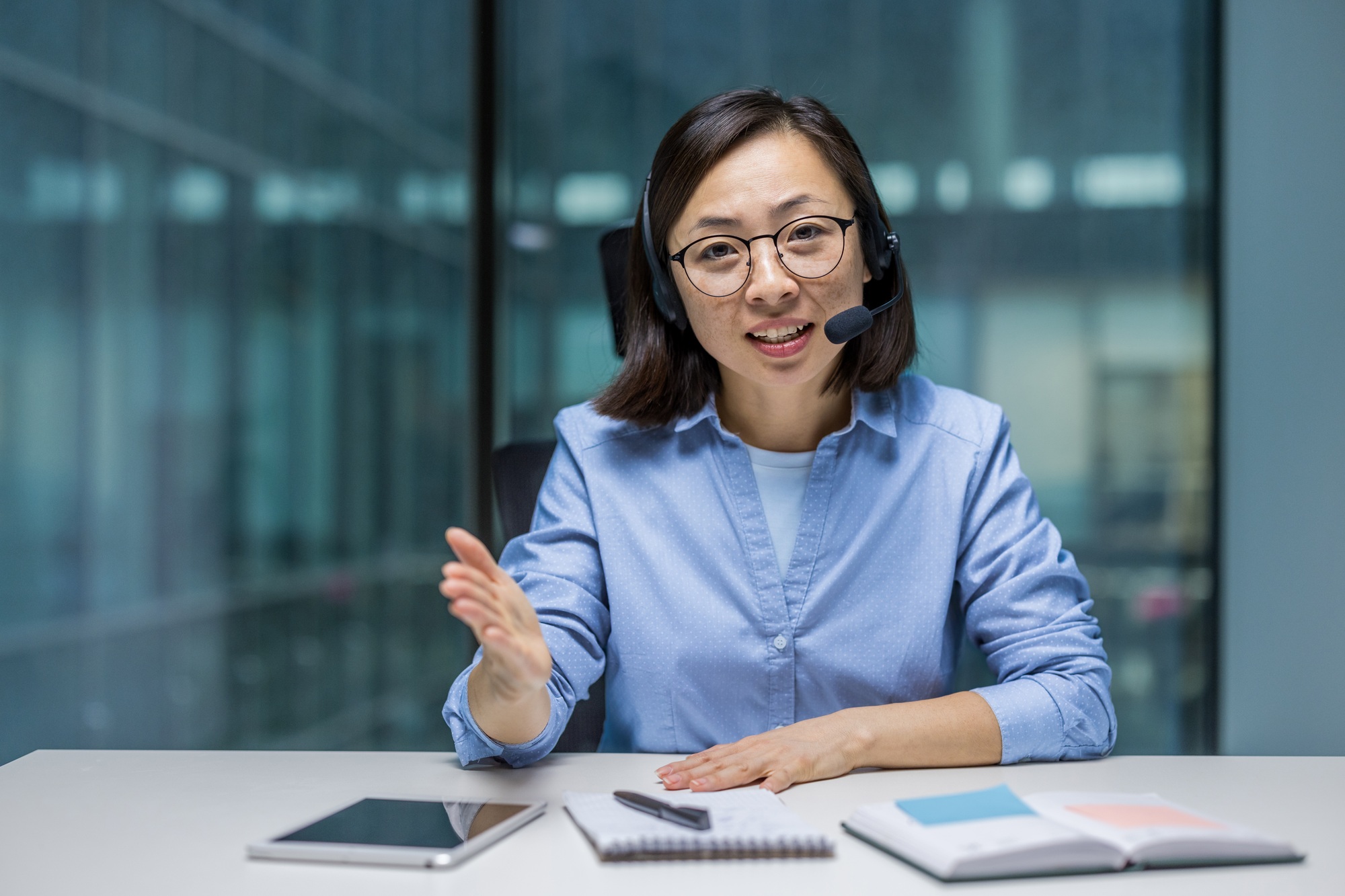 Asian businesswoman consulting clients online during a virtual meeting