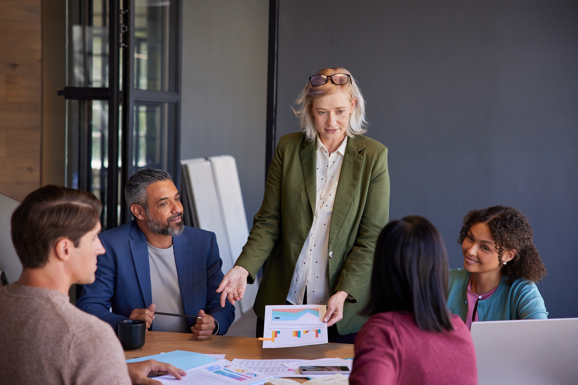 Mature businesswoman leading an annual report meeting